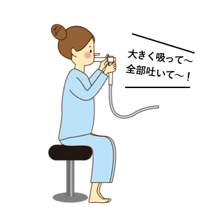 画像:呼吸機能検査をする女性